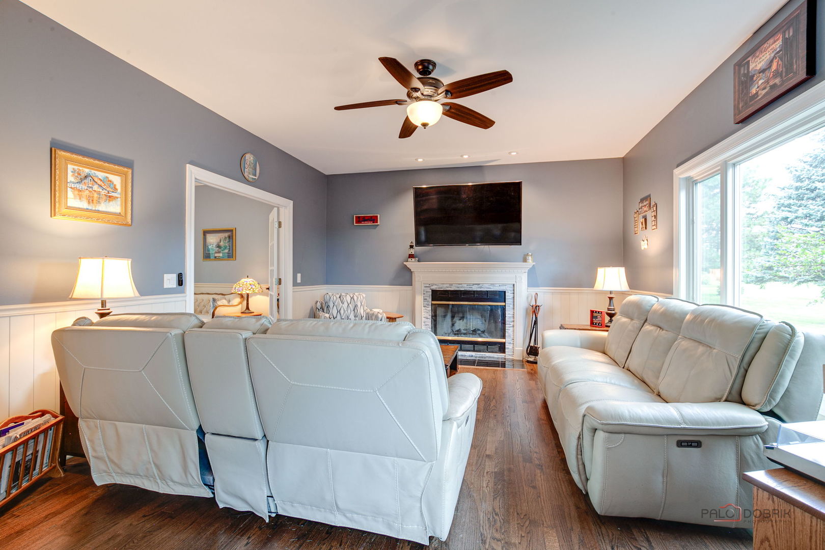 3313 Ridge Road Spring Grove, IL 60081 - Photo 14 of 49 a living room with furniture a fireplace and a flat screen tv