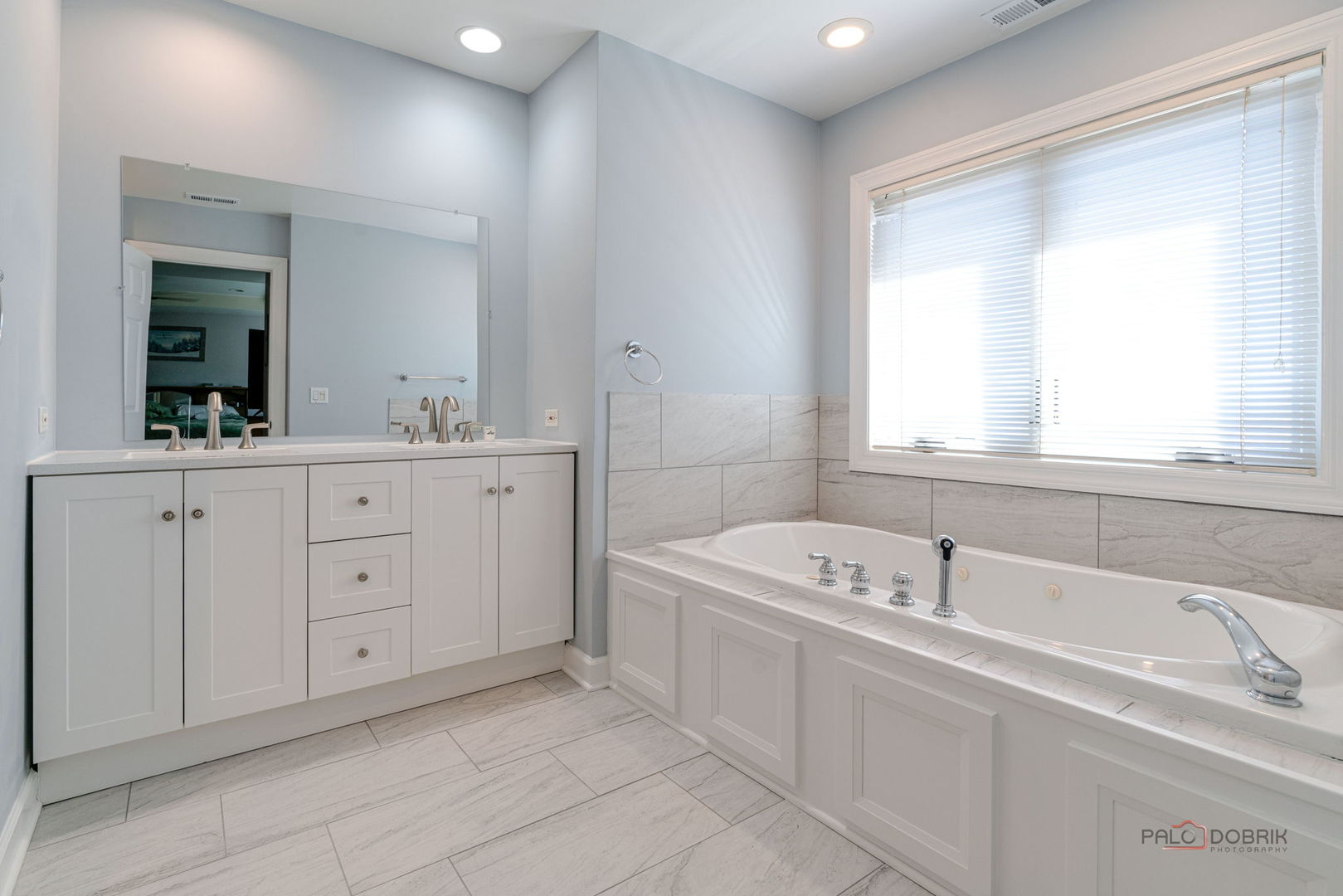 3313 Ridge Road Spring Grove, IL 60081 - Photo 26 of 49 a spacious bathroom with a tub sink and mirror