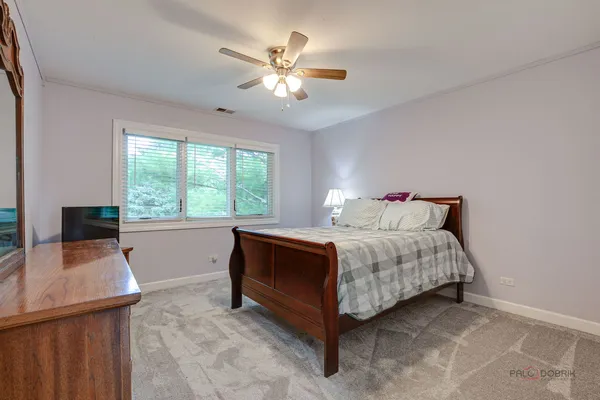 a bed room with a bed and a window