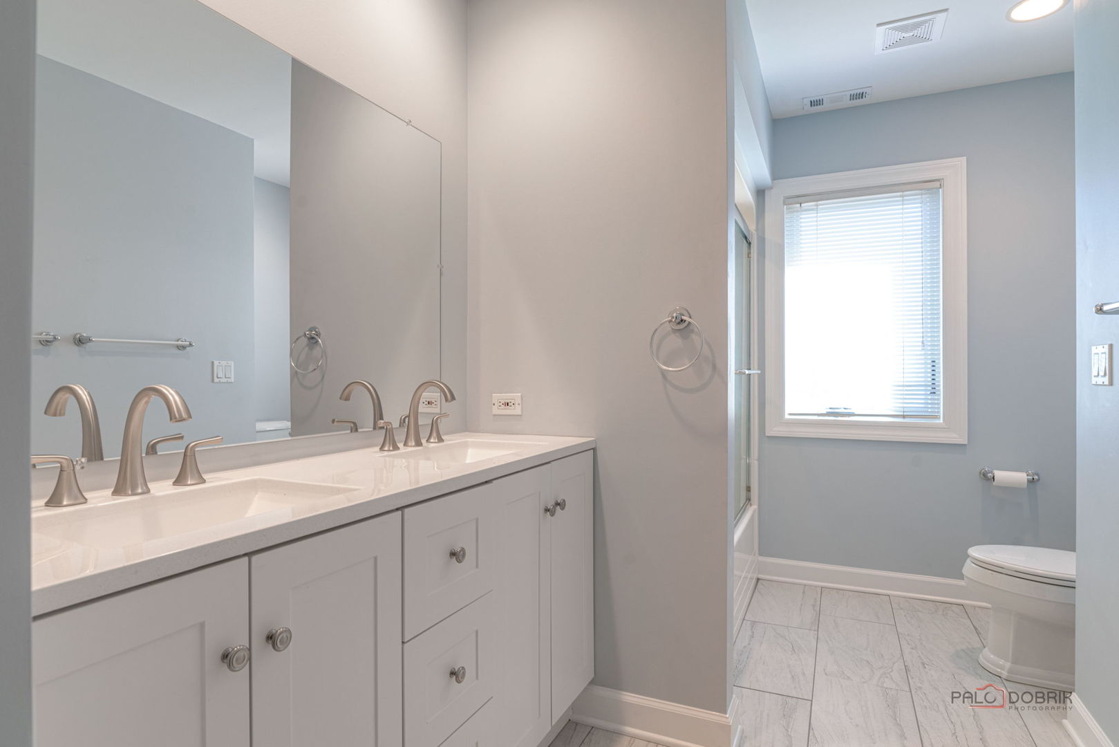 3313 Ridge Road Spring Grove, IL 60081 - Photo 34 of 49 a bathroom with a sink a toilet and a mirror