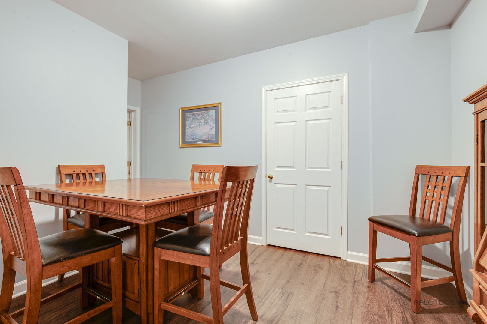 3313 Ridge Road Spring Grove, IL 60081 - Photo 37 of 49 a view of a dining room with furniture and wooden floor
