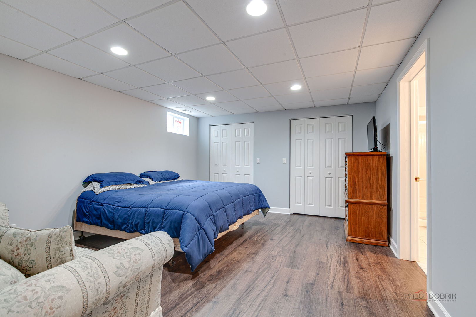 3313 Ridge Road Spring Grove, IL 60081 - Photo 38 of 49 a spacious bedroom with a bed and wooden floor