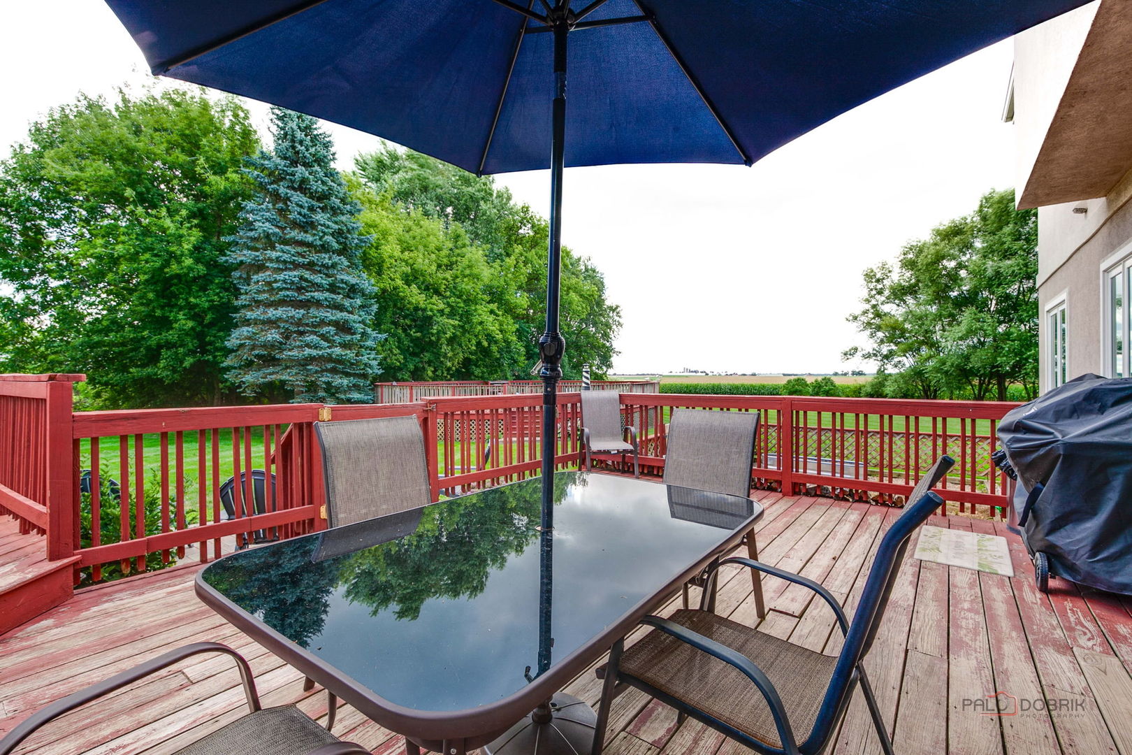 3313 Ridge Road Spring Grove, IL 60081 - Photo 47 of 49 a balcony with wooden floor and outdoor seating