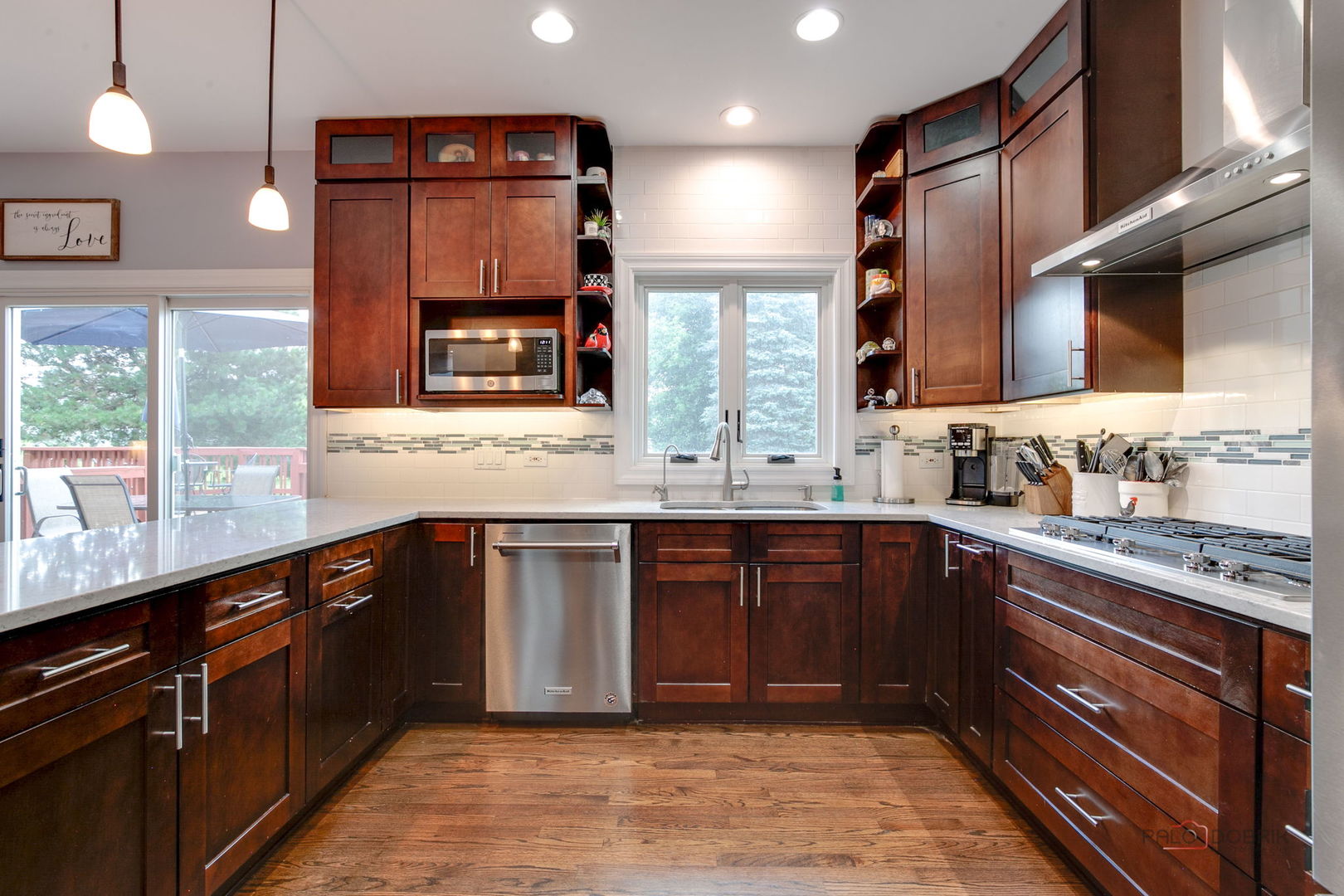 3313 Ridge Road Spring Grove, IL 60081 - Photo 9 of 49 a kitchen with stainless steel appliances granite countertop wooden cabinets and a counter top space
