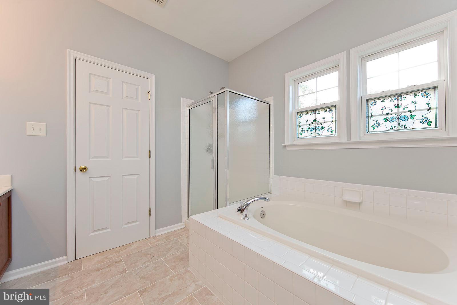2733 Hunting Ridge Road Winchester, VA 22603 - Photo 33 of 68 Master bathroom with large tub and shower