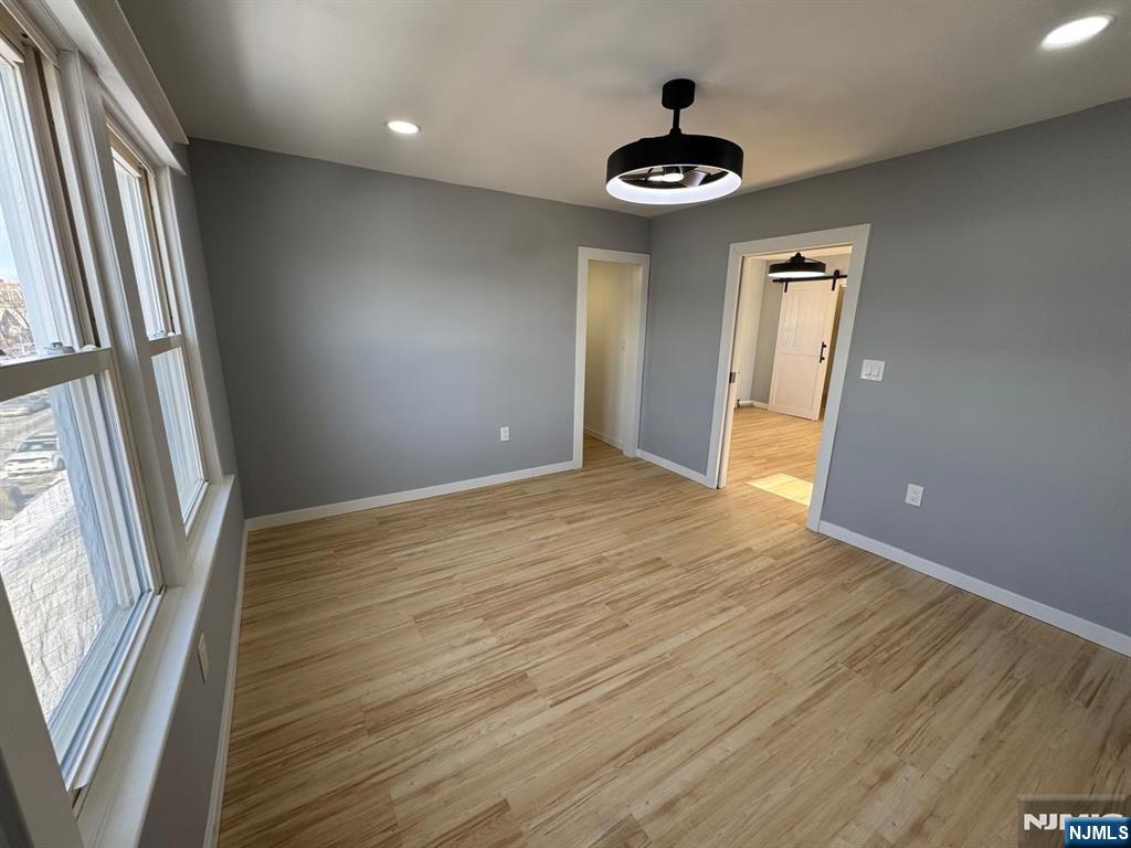 166 Rutherford Place, Unit 2 North Arlington, NJ 07031 - Photo 4 of 10 a view of an empty room with a window
