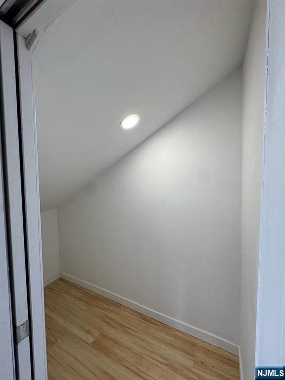 166 Rutherford Place, Unit 2 North Arlington, NJ 07031 - Photo 5 of 10 a view of wooden floor and closet in a small room