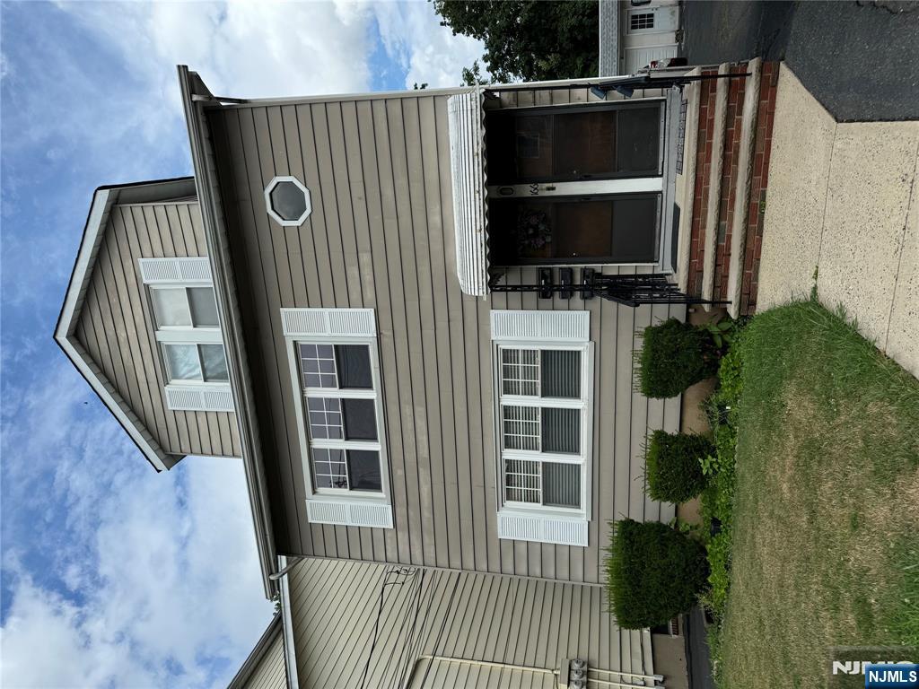 166 Rutherford Place, Unit 2 North Arlington, NJ 07031 - Photo 10 of 10 a front view of a house with a yard