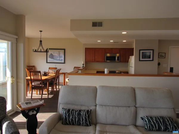 a view of kitchen with dining table and chairs