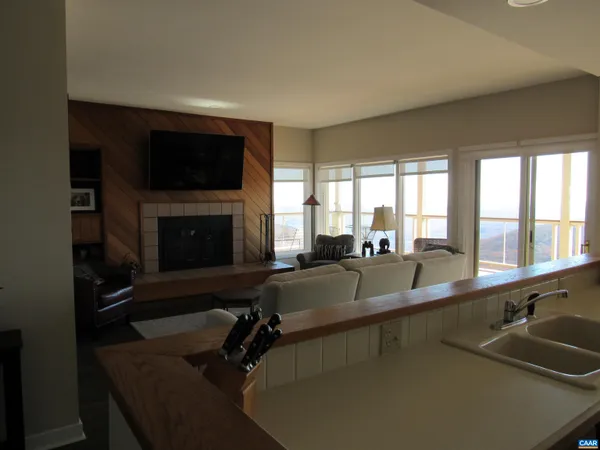 a living room with furniture window and a fireplace