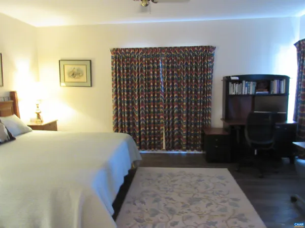 a bedroom with a bed and a walk in closet