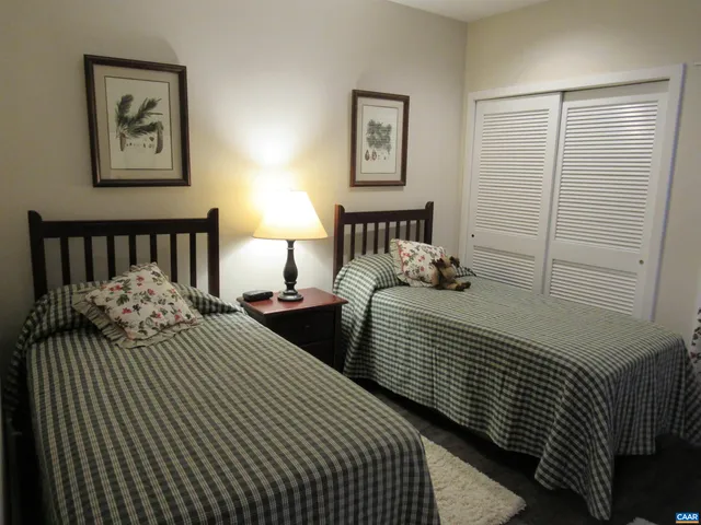 a bedroom with double bed and a night stand