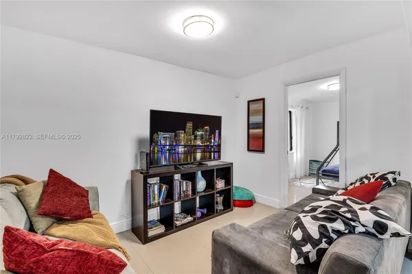a bedroom with furniture and a book shelf