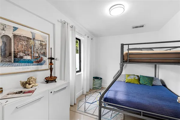 a room with wooden floor and furniture