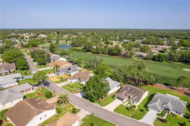 a view of a dining room with furniture large window and outside view