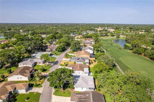 a kitchen with cabinets a stove and a window
