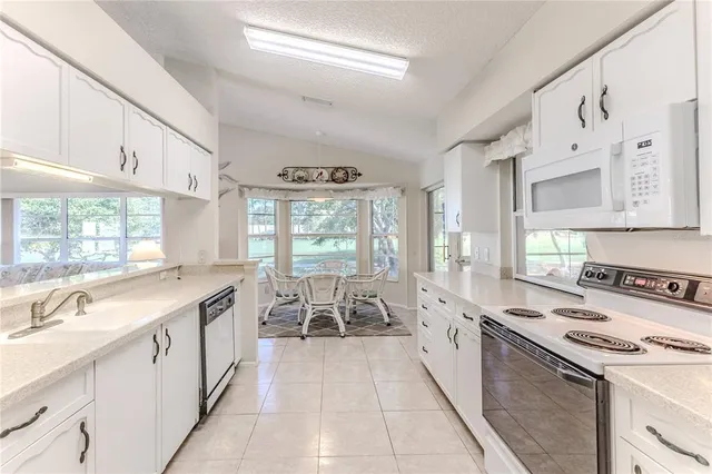 a bedroom with a bed and flat screen tv