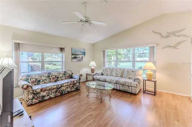 a view of a ceiling fan and wooden floor