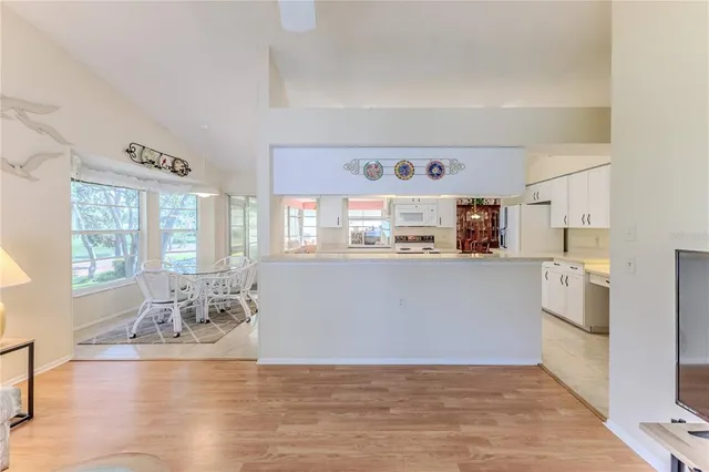 a view of a room with wooden floor