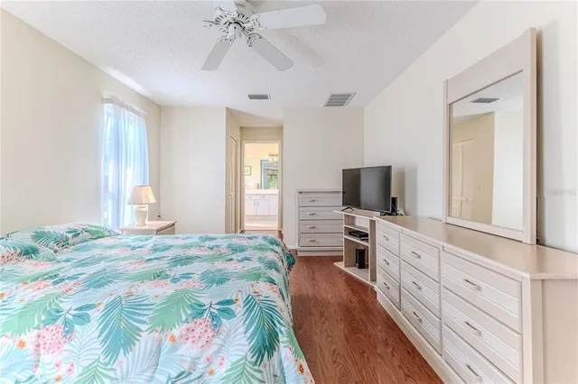 a view of room with window and a ceiling fan