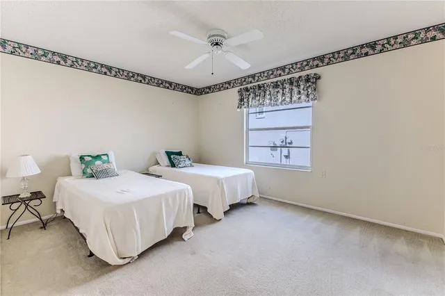 an aerial view of a house with a garden and swimming pool