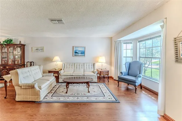 an aerial view of residential houses with outdoor space and swimming pool
