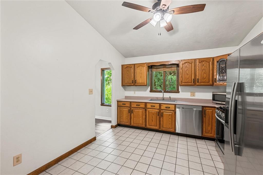 210 Arner Road Freeport, PA 16229 - Photo 11 of 40 a kitchen with stainless steel appliances granite countertop a stove a sink and a refrigerator