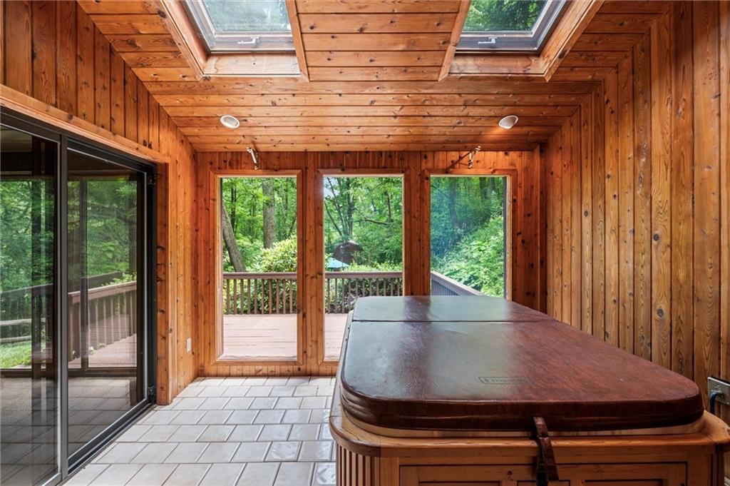 210 Arner Road Freeport, PA 16229 - Photo 24 of 40 a view of a patio with table and chairs and floor to ceiling window with wooden fence