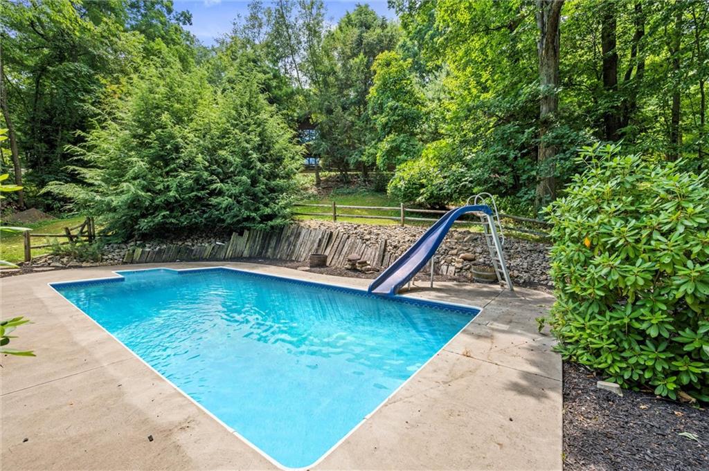 210 Arner Road Freeport, PA 16229 - Photo 32 of 40 a view of a swimming pool with a patio and a yard