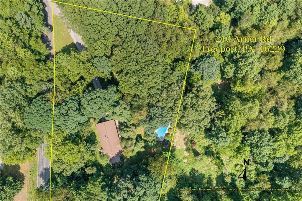 210 Arner Road Freeport, PA 16229 - Photo 35 of 40 a aerial view of a house with a yard and sitting area