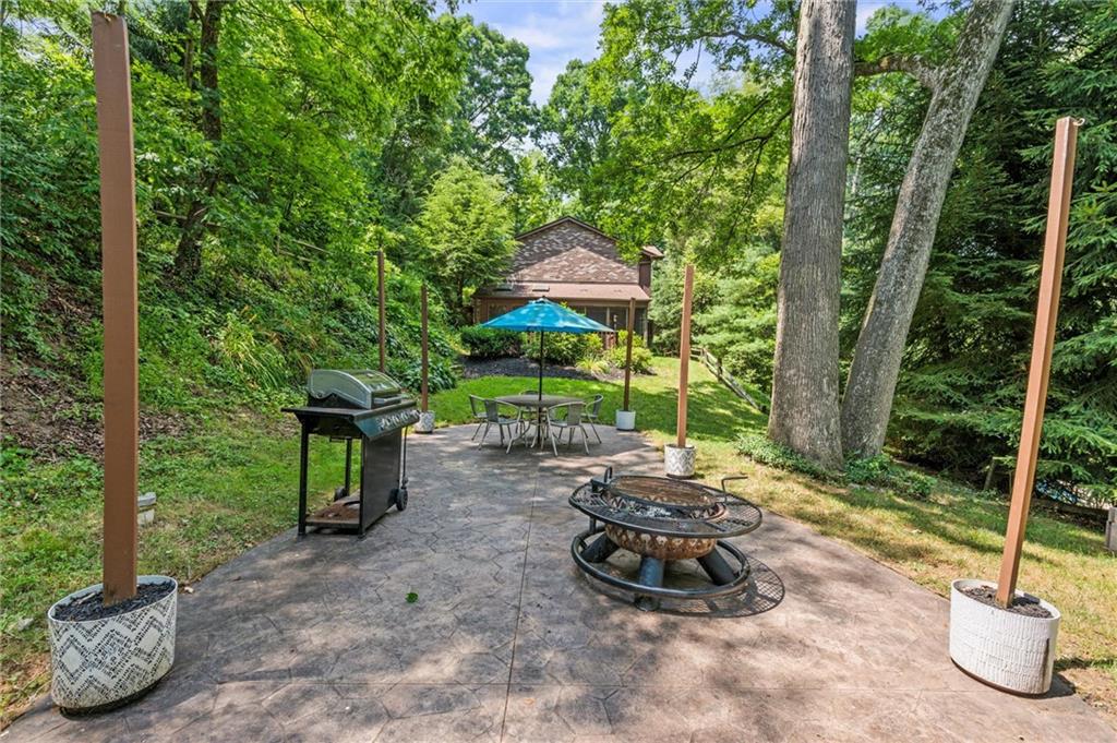 210 Arner Road Freeport, PA 16229 - Photo 4 of 40 a view of a chair and tables in the backyard
