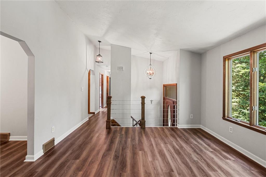 210 Arner Road Freeport, PA 16229 - Photo 7 of 40 a view of empty room with wooden floor and window