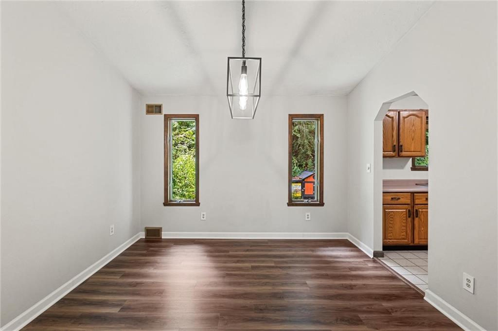 210 Arner Road Freeport, PA 16229 - Photo 8 of 40 an empty room with windows and cabinet