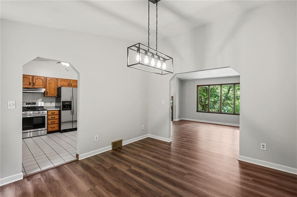 210 Arner Road Freeport, PA 16229 - Photo 9 of 40 a view of a room with wooden floor kitchen view and a window