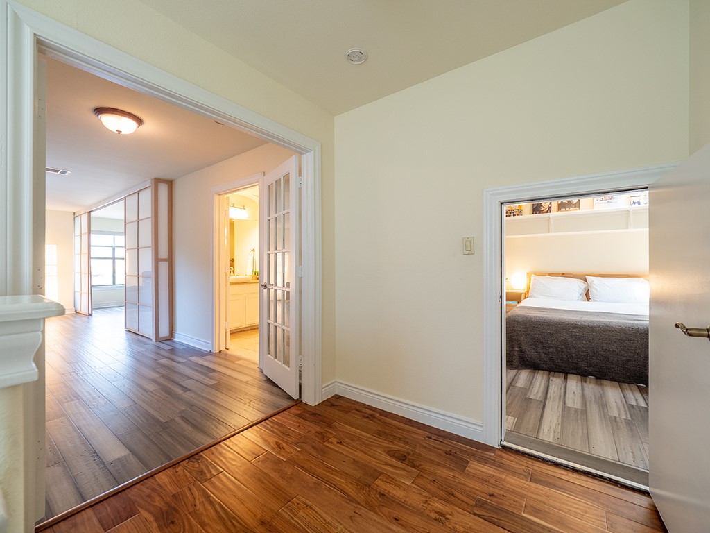 3609 Clawson Road, Unit B Austin, TX 78704 - Photo 21 of 28 Interior hallway with warm-toned wood-finish flooring