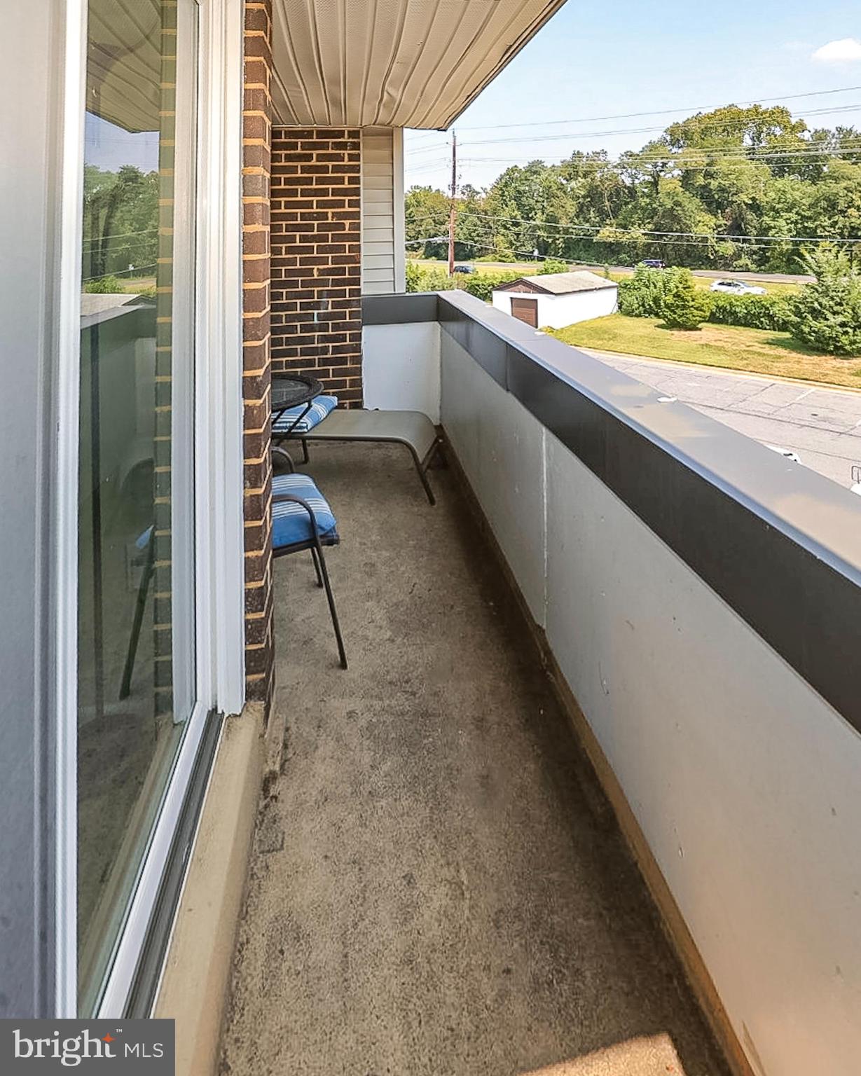 10214 Prince Place, Unit 8202 Upper Marlboro, MD 20774 - Photo 20 of 22 a view of a balcony with a table and chairs