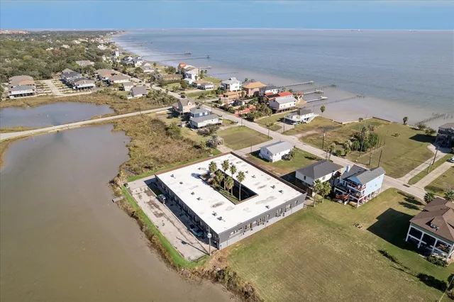 an aerial view of a house with a ocean view