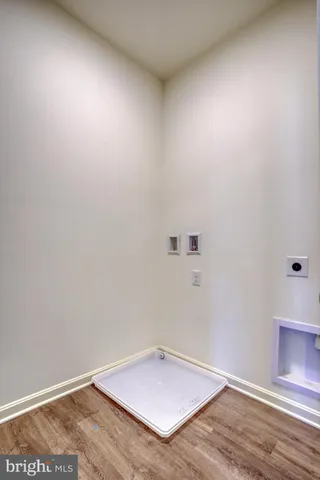 an empty room with wooden floor