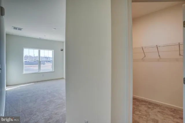 a view of an empty room with a window