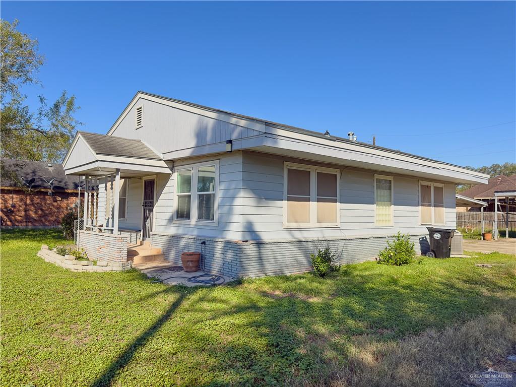 706 West 10th Street Weslaco, TX 78596 - Photo 2 of 14 a view of a house with a yard porch and sitting area
