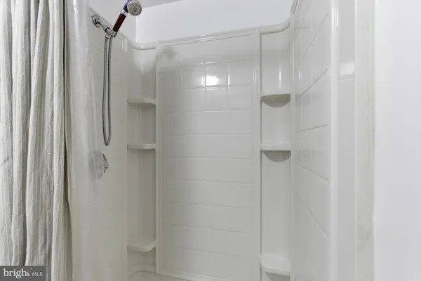 a bedroom with a bed and a television