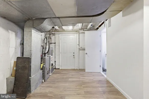 a view of a brick house with a yard in front of it