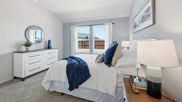 a bed room with a bed and a window