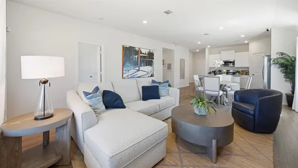 a living room with furniture and a table