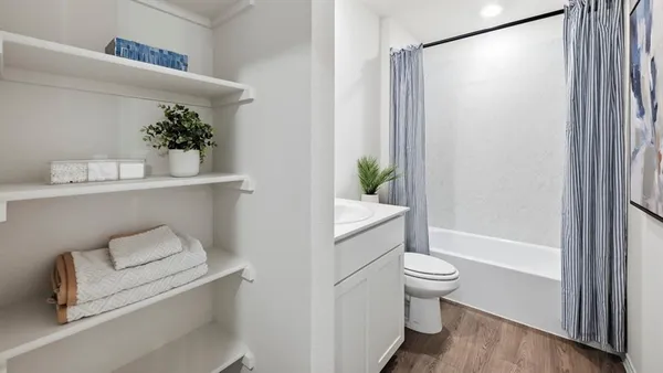 a bathroom with a shower and a toilet