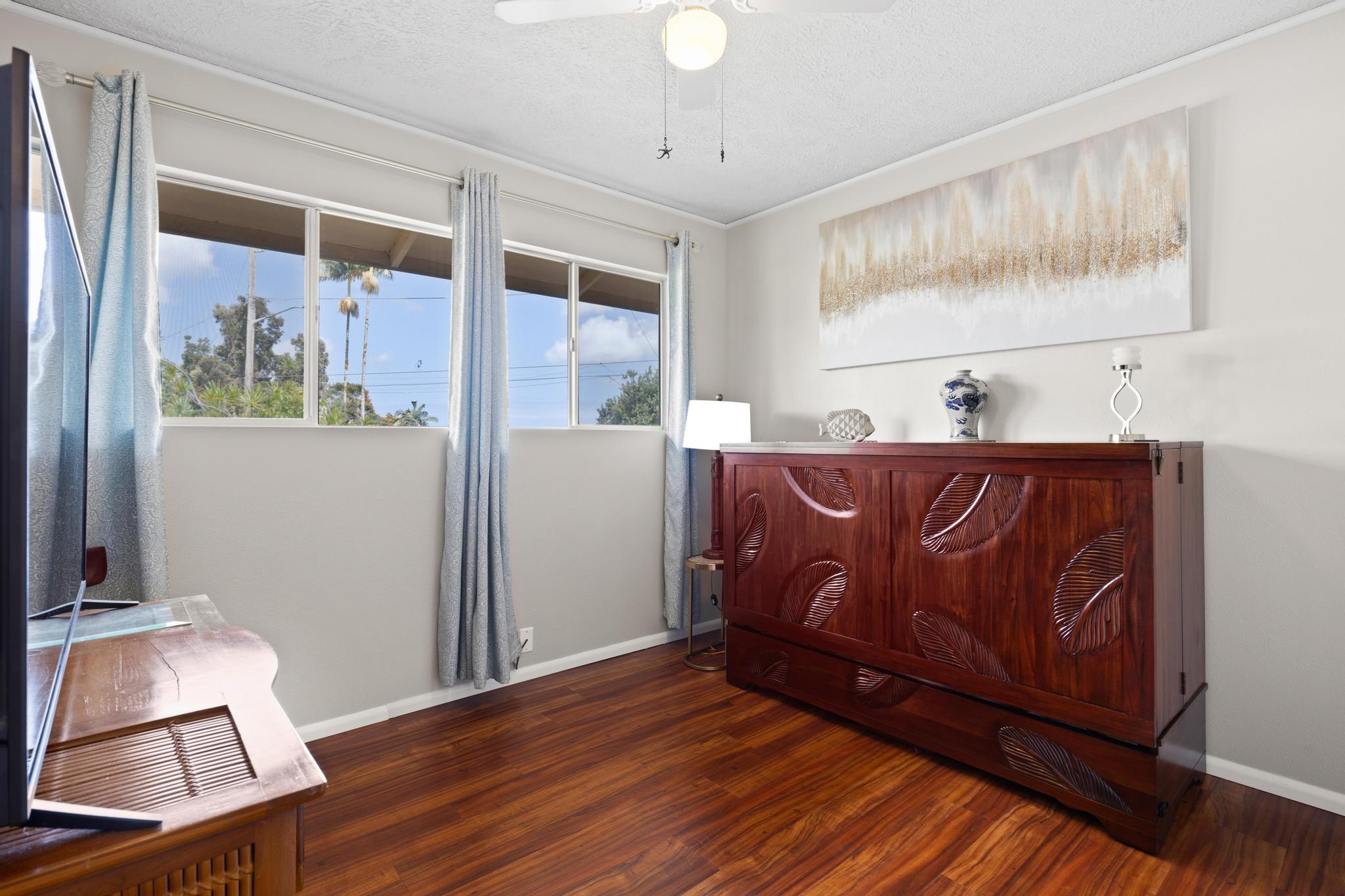 1646 Oneawa Place Hilo, HI 96720 - Photo 16 of 24 a room with furniture and wooden floor
