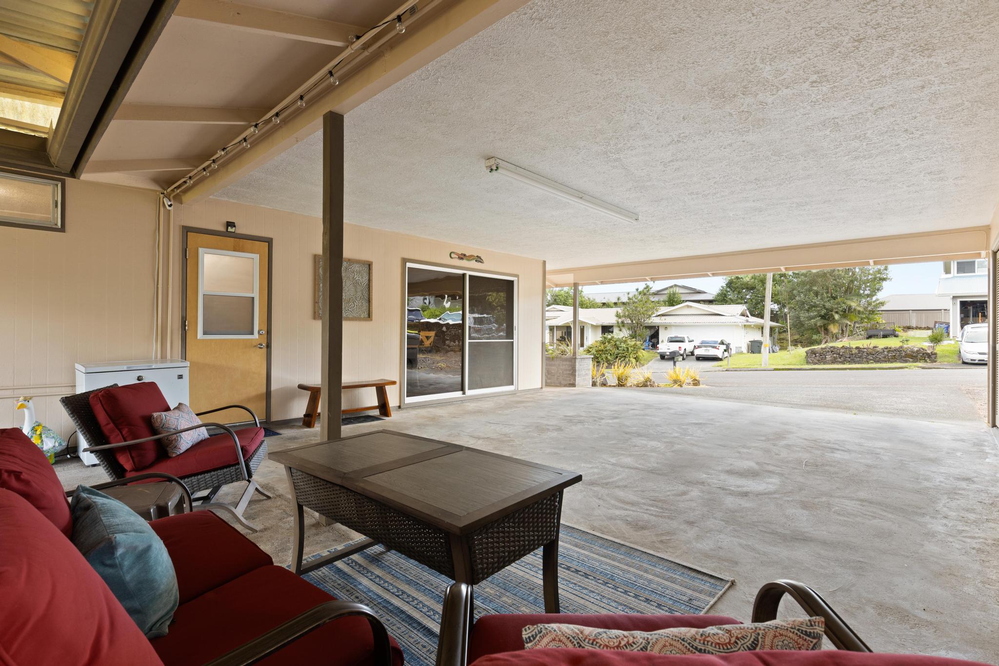 1646 Oneawa Place Hilo, HI 96720 - Photo 18 of 24 a living room with furniture and a floor to ceiling window