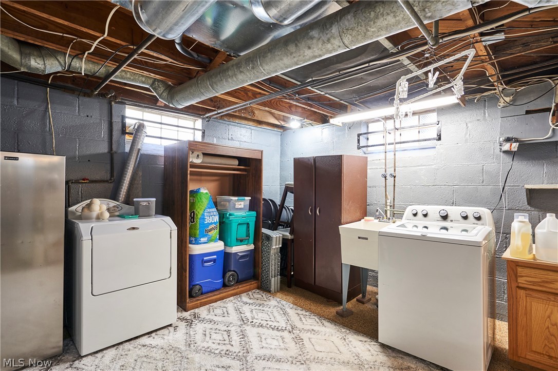 28322 Forest Road Willowick, OH 44095 - Photo 31 of 32 Basement with independent washer and dryer and stainless steel fridge