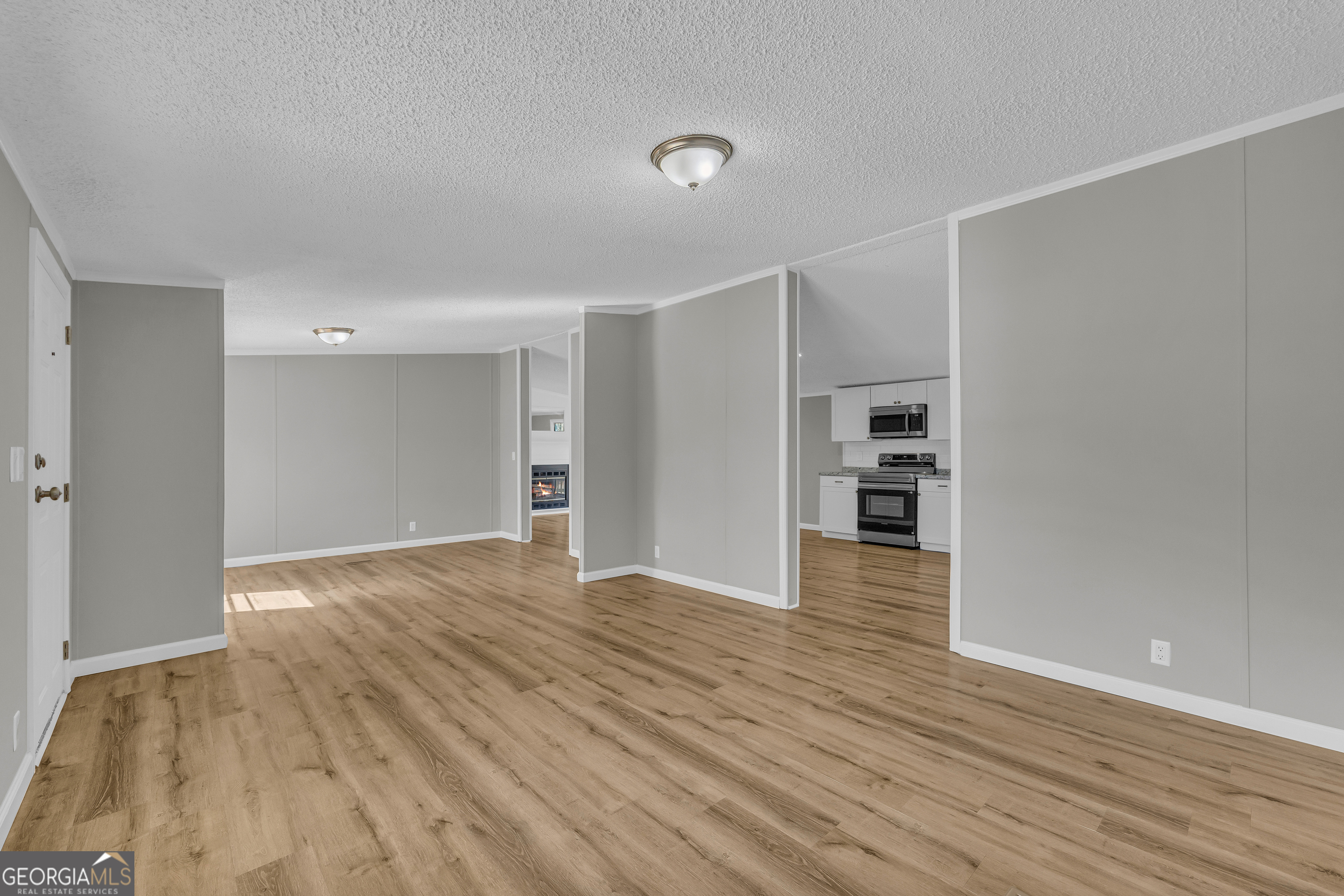 199 Alberta Drive Colbert, GA 30628 - Photo 12 of 39 a view of empty room with wooden floor