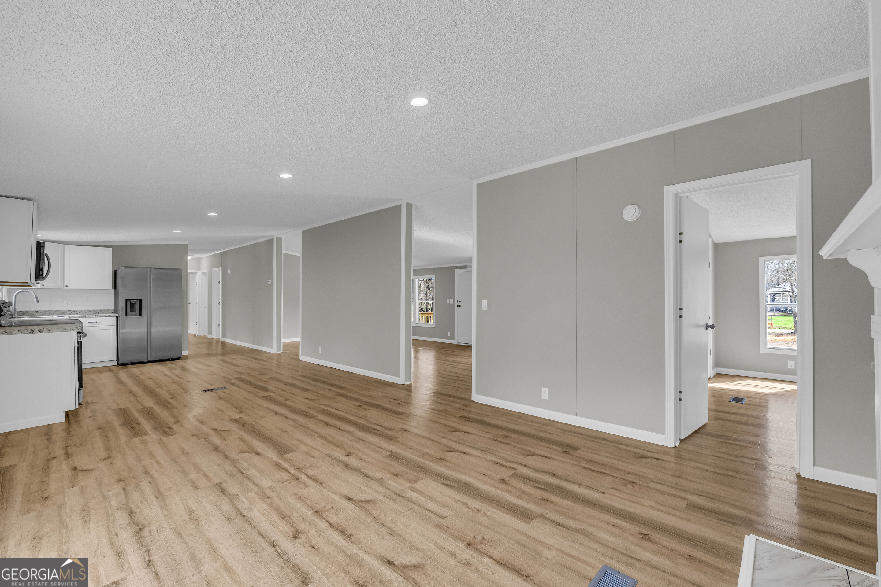 199 Alberta Drive Colbert, GA 30628 - Photo 15 of 39 a view of empty room with wooden floor